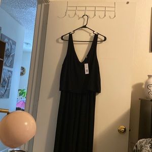 One piece black v neck front and back. Cape like top & are culottes